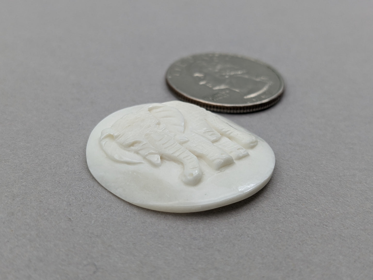 Carved bovine bone elephant cabochon