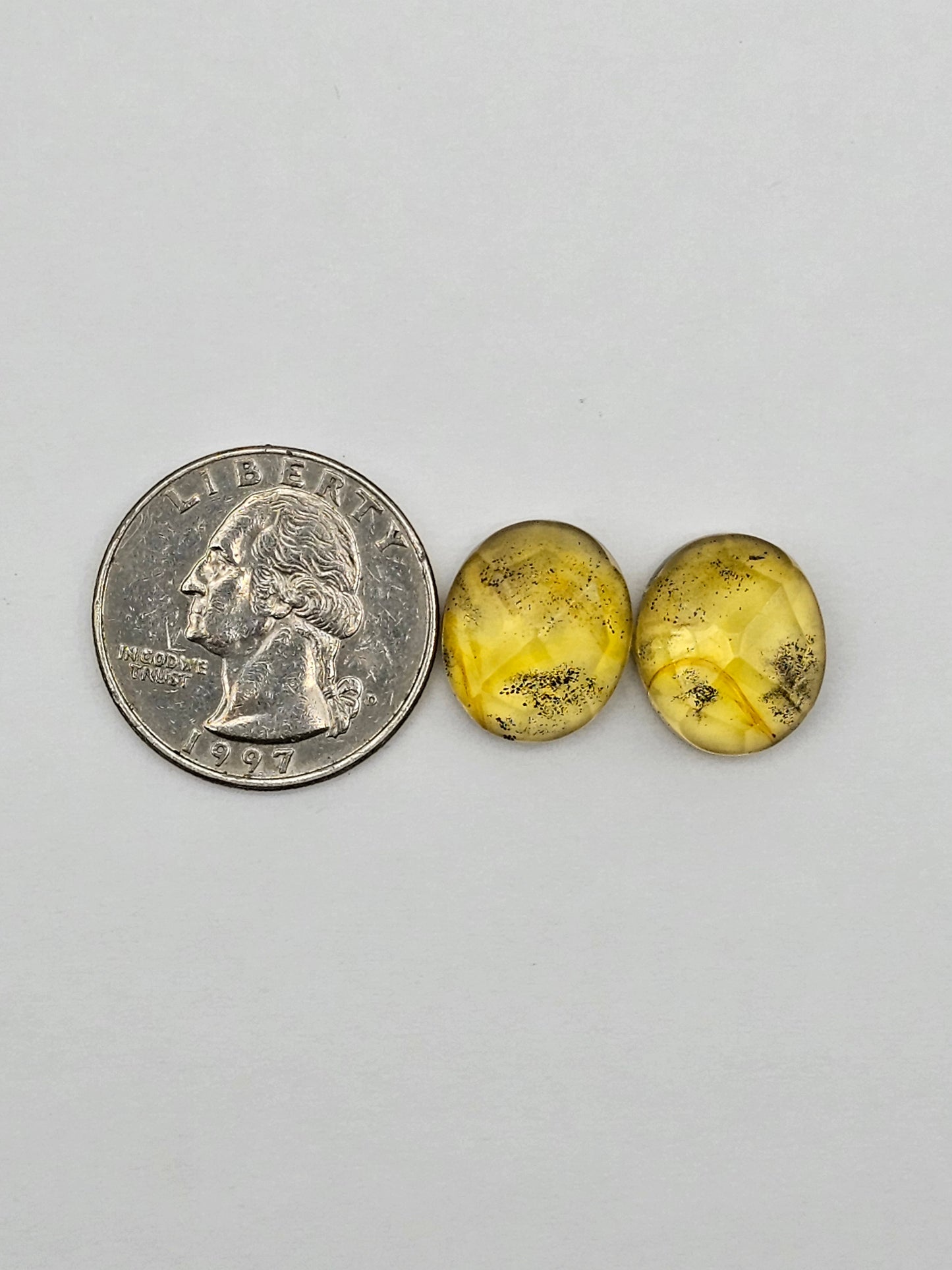 Amber faceted oval pair