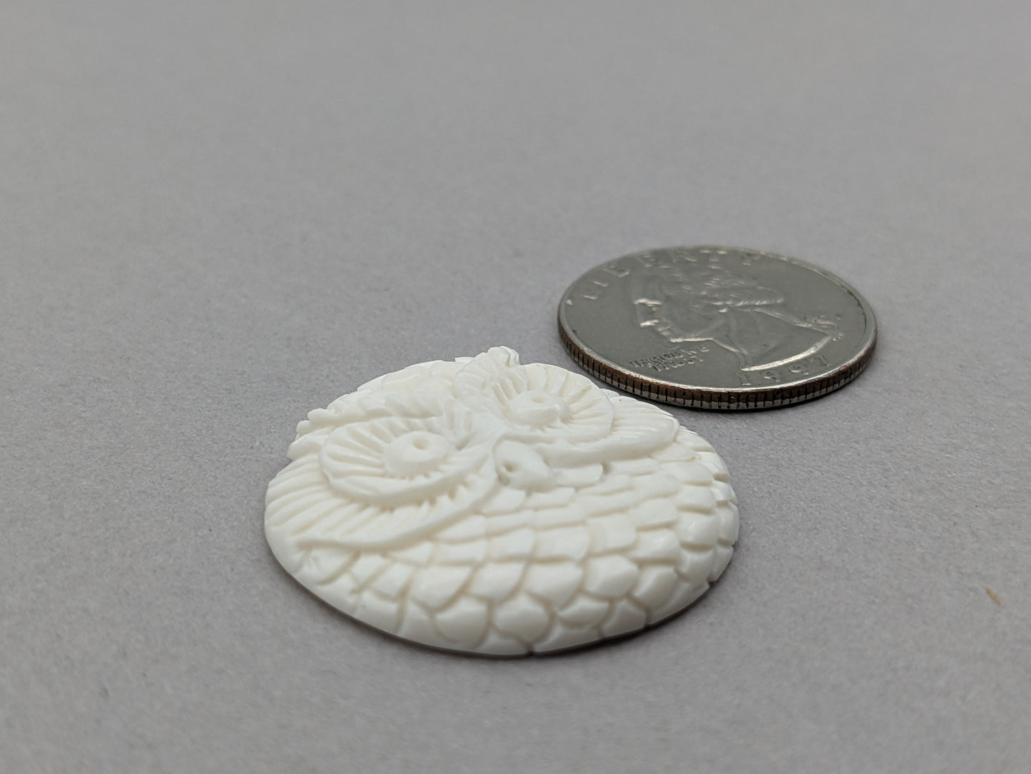 Carved bovine bone owl cabochon