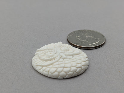 Carved bovine bone owl cabochon